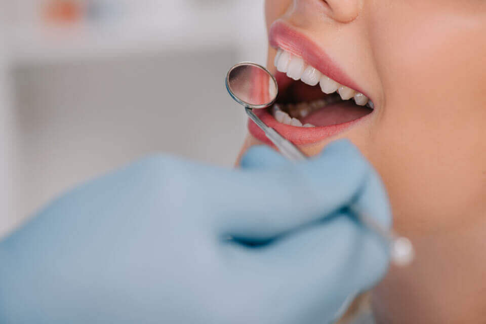 dentist examining patients teeth