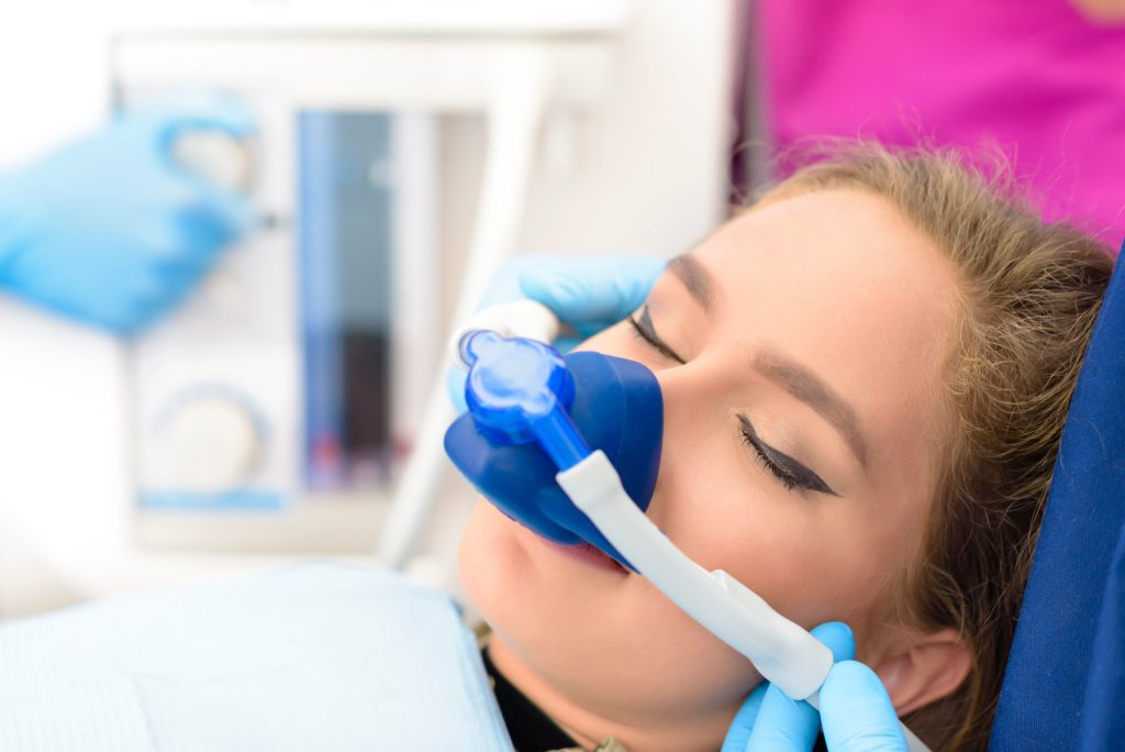 patient receiving laughing gas before dental checkup