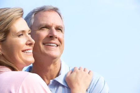 couple smiling with dental implants